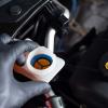 Mechanic checking brake fluid